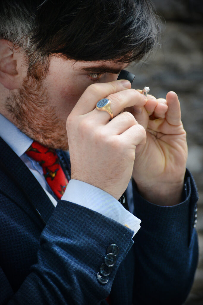 Matthew Weldon looking at a ring