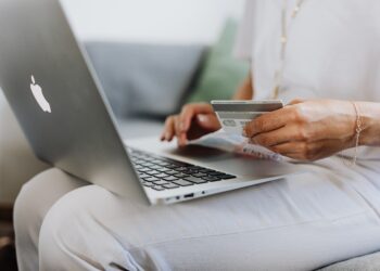 someone using a card to shop online