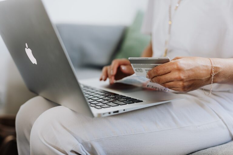 someone using a card to shop online
