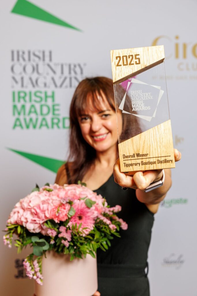 The overall winner of the 2025 Irish Made Awards holding her trophy