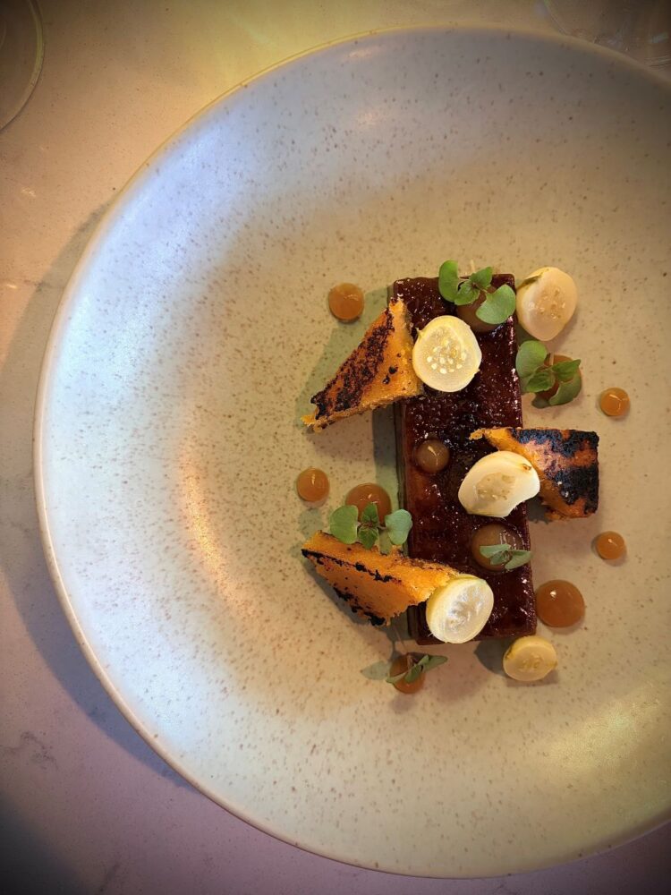 Recipe: Black garlic crème brûlée with grilled cornbread, salted gooseberries and meadowsweet